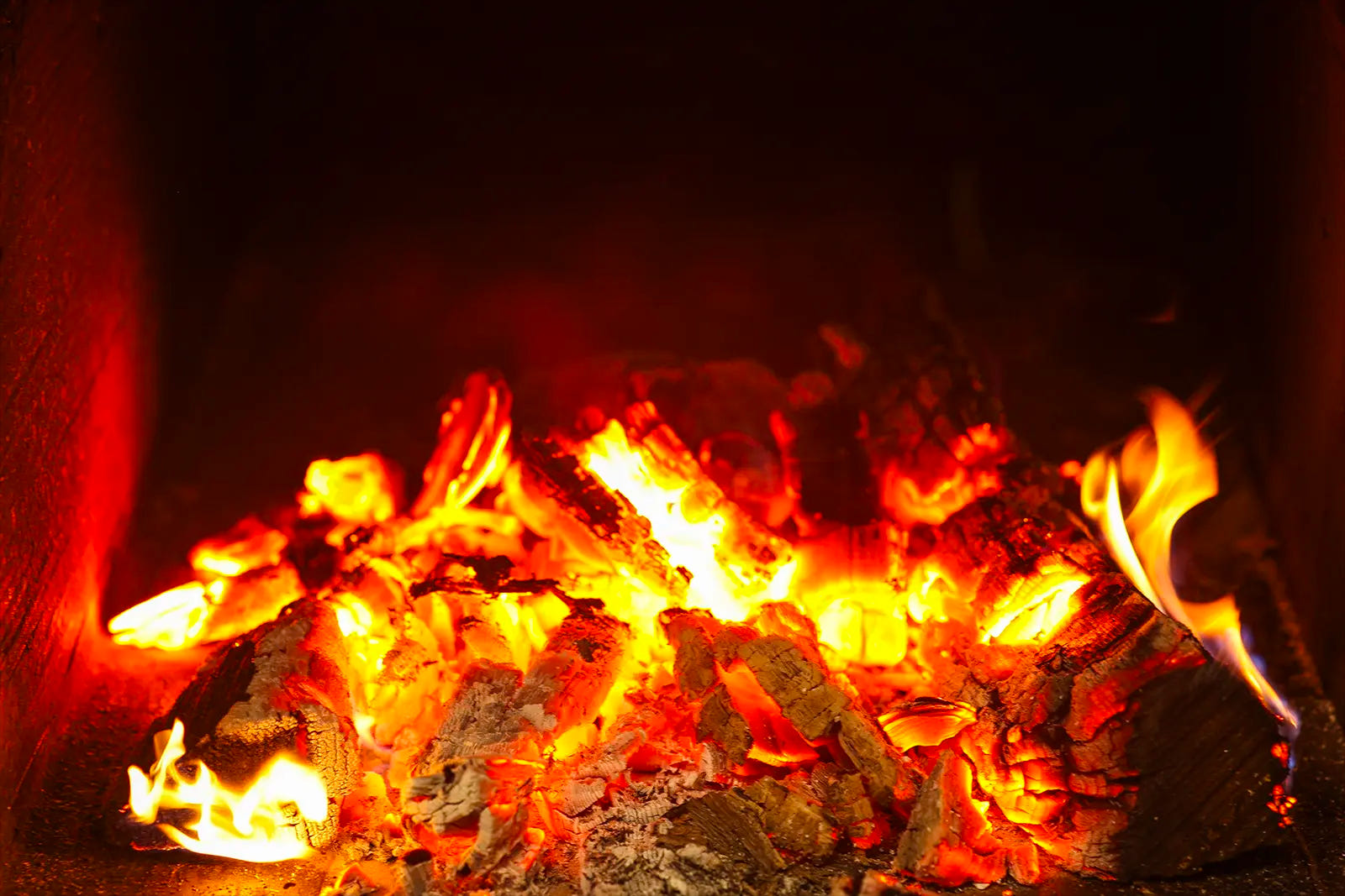 Lit firebox at Pendragon’s Smokehouse promoting BBQ delivery in Montclair