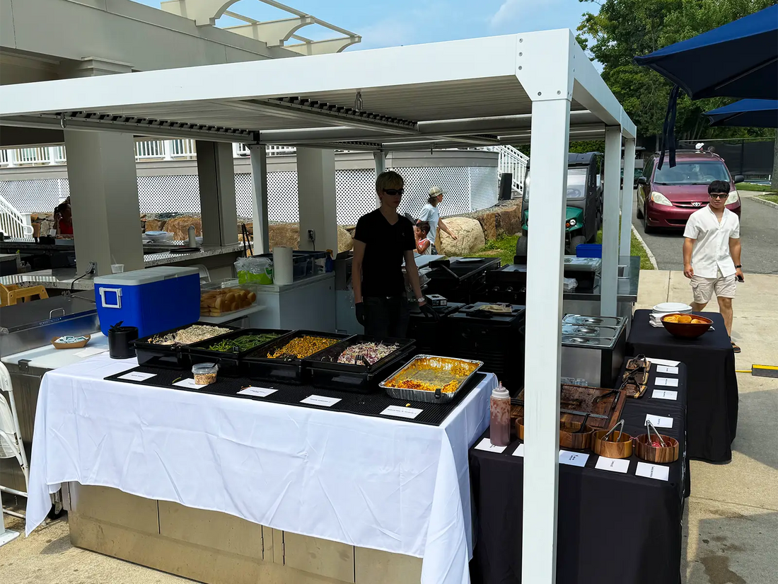 Pendragon’s Smokehouse staff serving smoked BBQ at a Northern New Jersey corporate catering event
