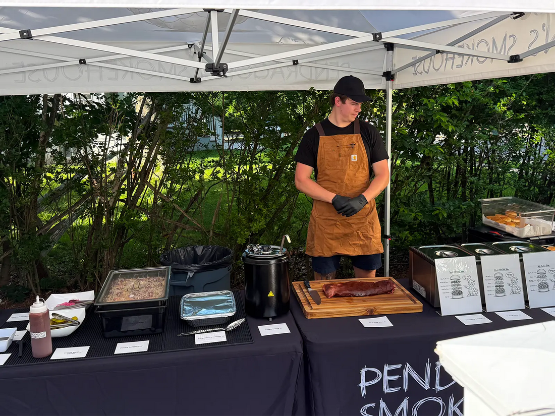 Pendragon’s Smokehouse corporate BBQ catering setup with staff serving at a business event in Northern New Jersey