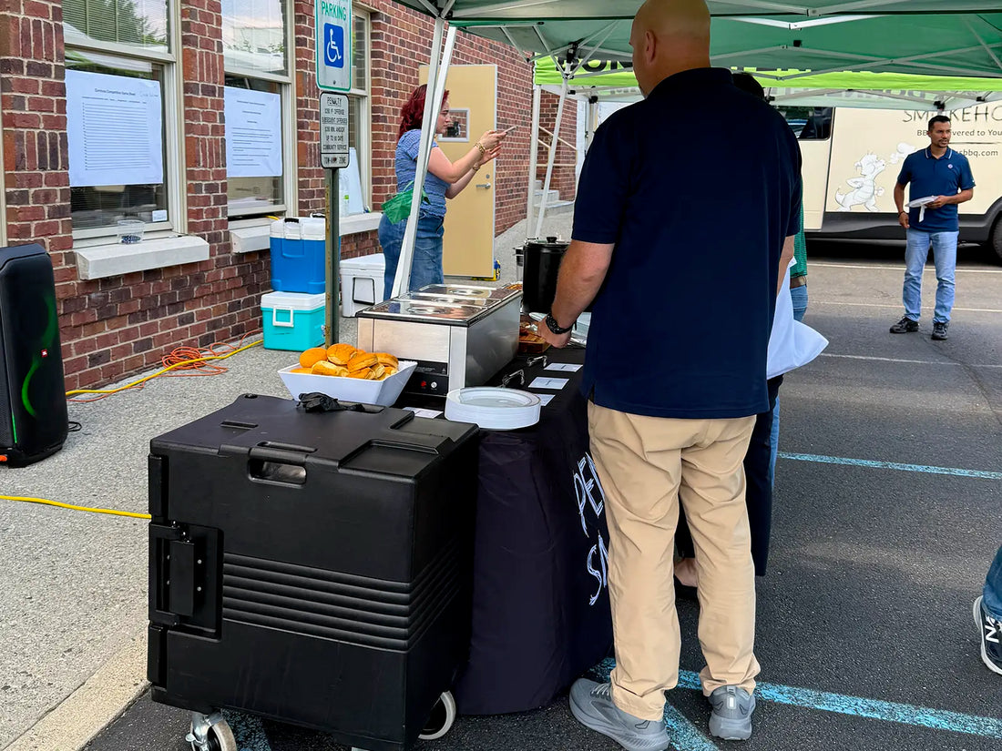 Guests enjoying Pendragon’s Smokehouse corporate catering at an office event in Northern New Jersey