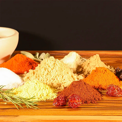 Bold spice blend for Dragon’s Breath #3 ribs with dark chiles, habanero powder, and aromatic seasonings in neat piles