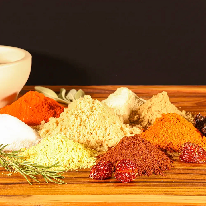 Bold spice blend for Dragon’s Breath #3 ribs with dark chiles, habanero powder, and aromatic seasonings in neat piles