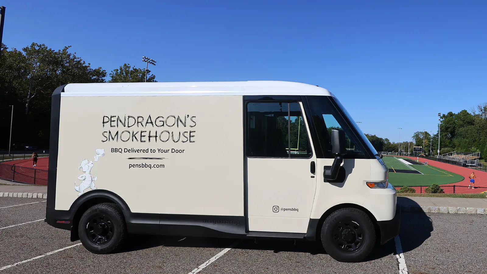 White van with 'Pendragon's Smokehouse' branding at Panther Park, Cedar Grove