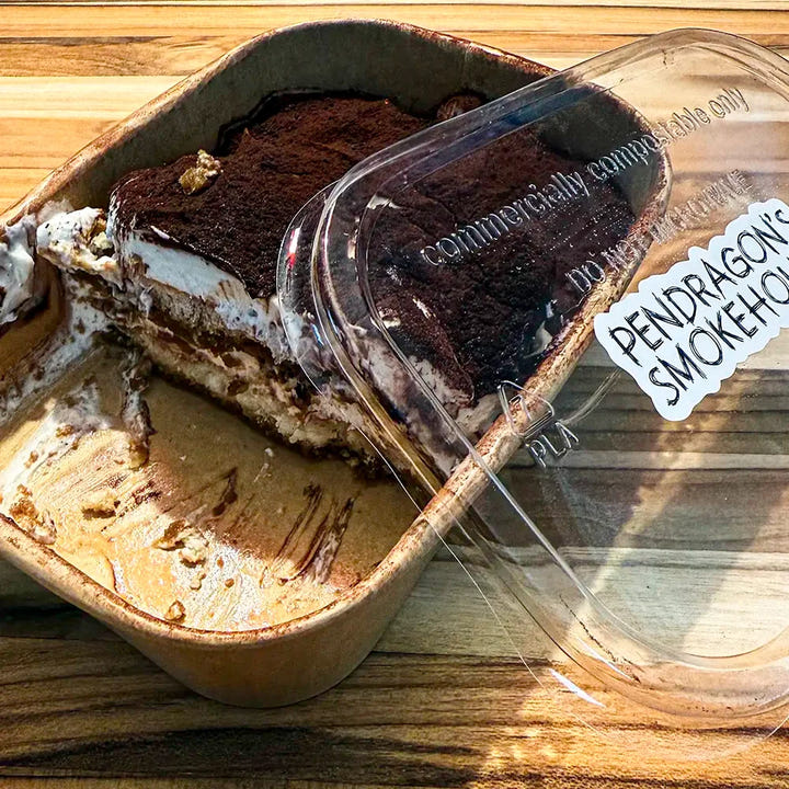 Sophie’s Tiramisu partially spooned out, revealing creamy mascarpone and espresso layers in a chilled dessert pot